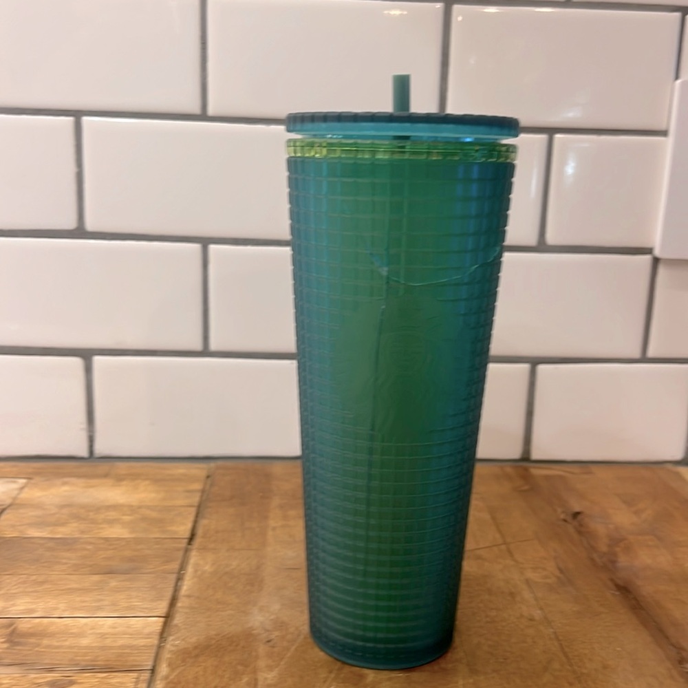 Starbucks cup in light and dark green. 💚